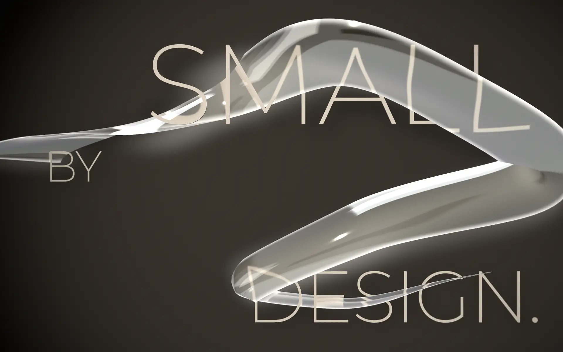 The Thread: a ribbon of clear glass through the words SMALL BY DESIGN, on the studio’s charcoal.